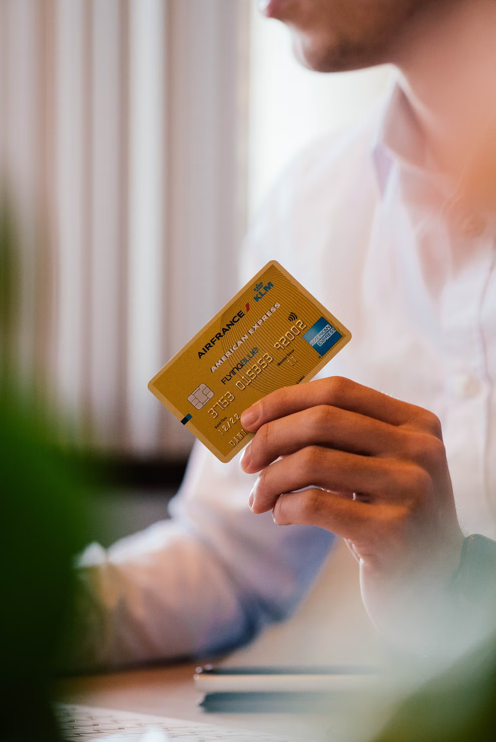 Man making a purchase with an American Express card